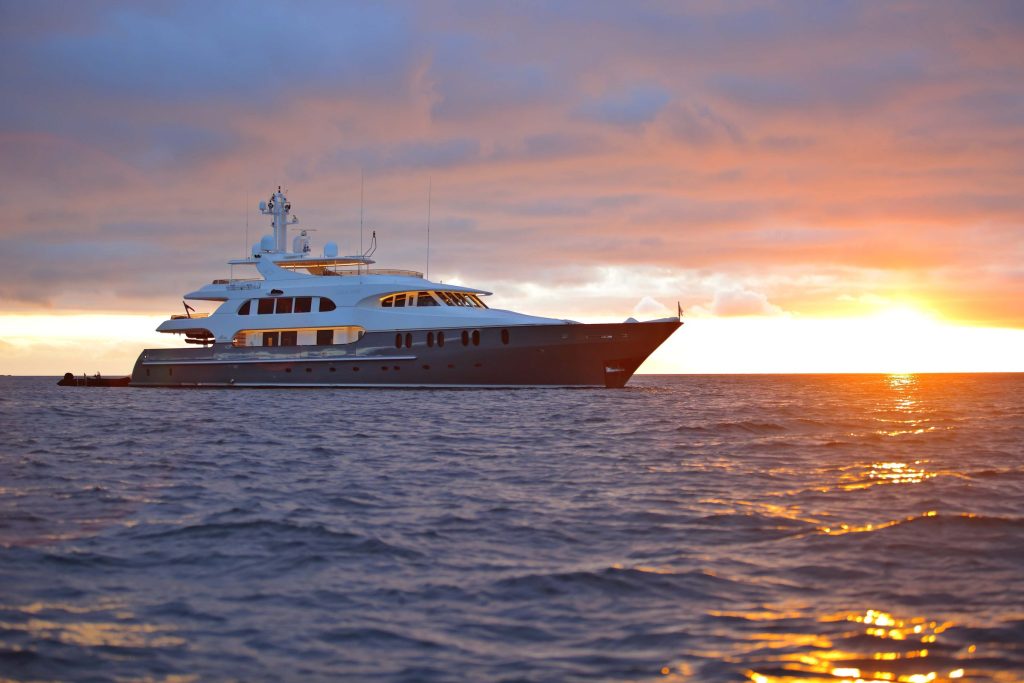 Aqua Mare superyacht at sunset in the Galápagos